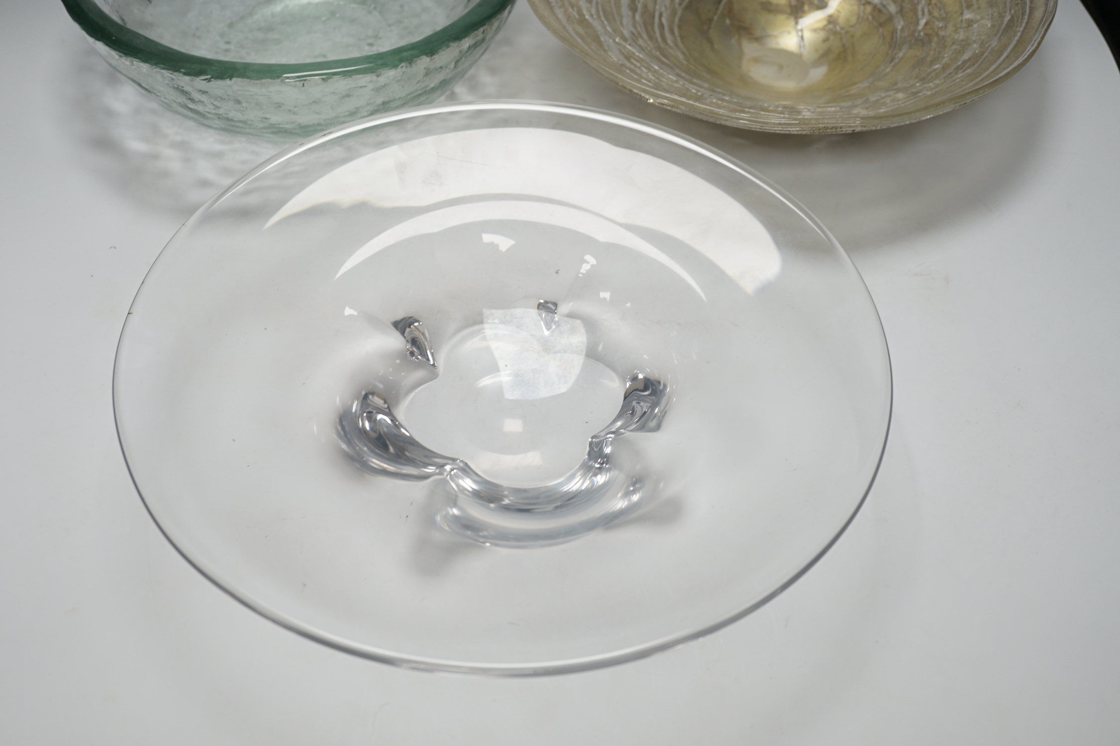 Three glass dishes, including one by Orrefors and one by A A Designs, largest 35cm in diameter